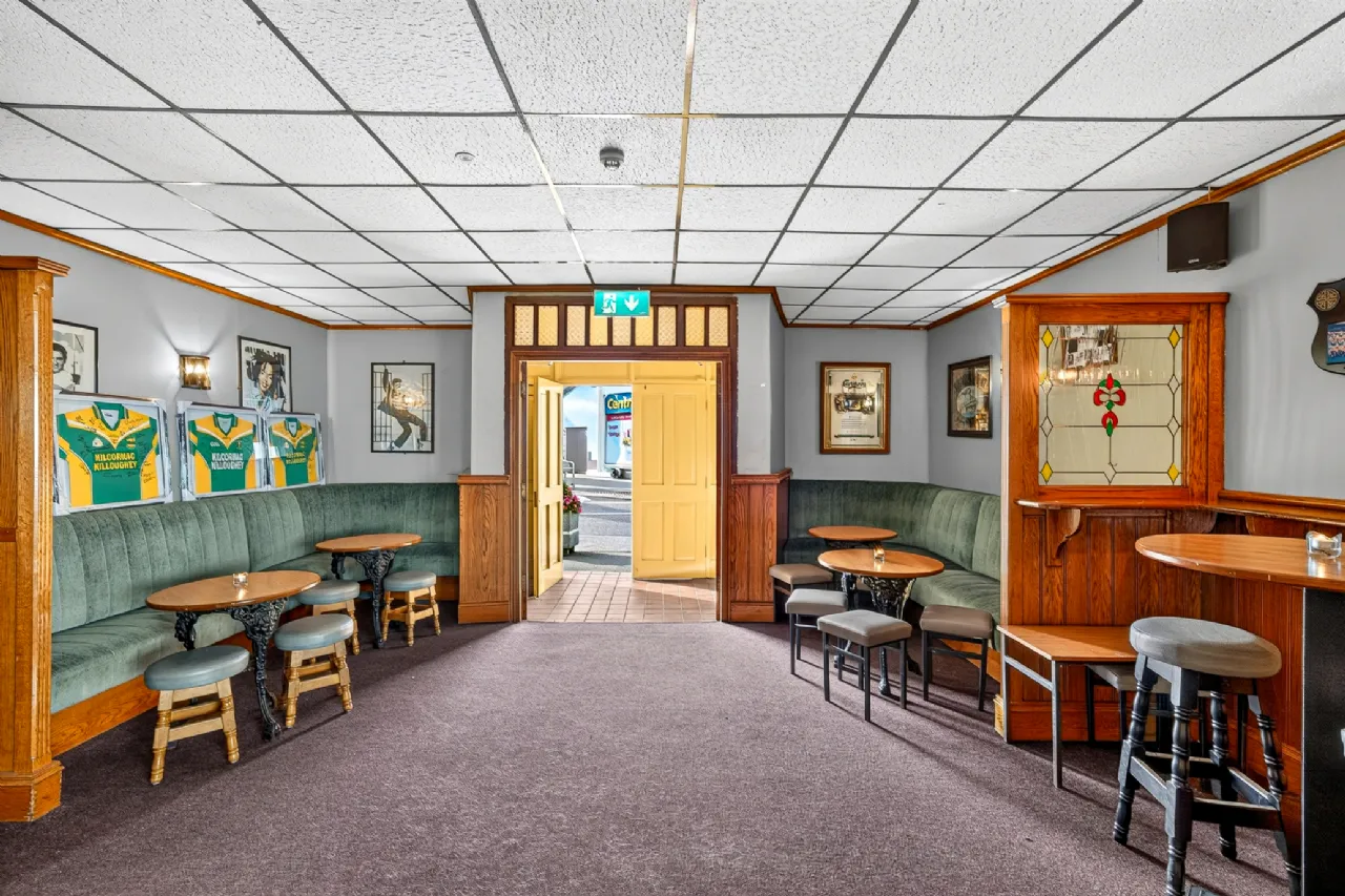 Lounge with banquette seating and stained glass