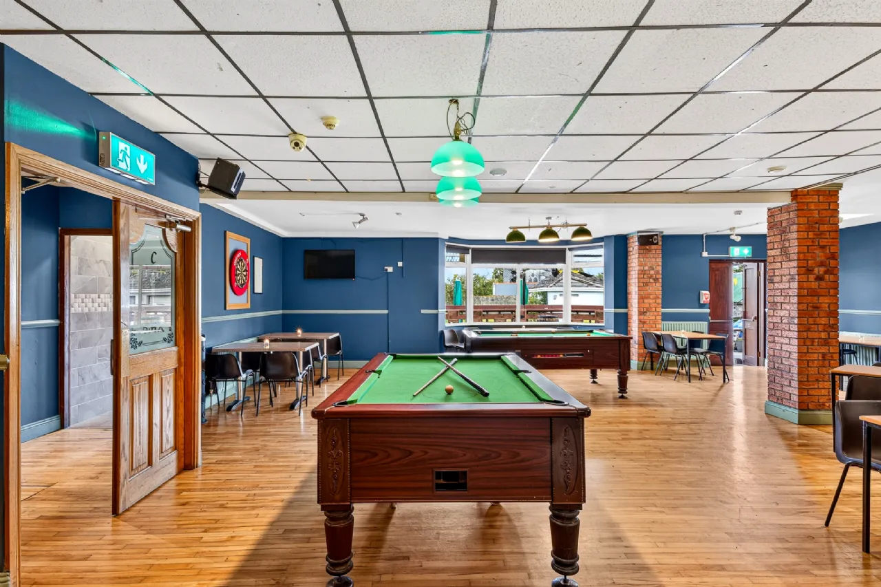 Function room with pool tables and maple floors